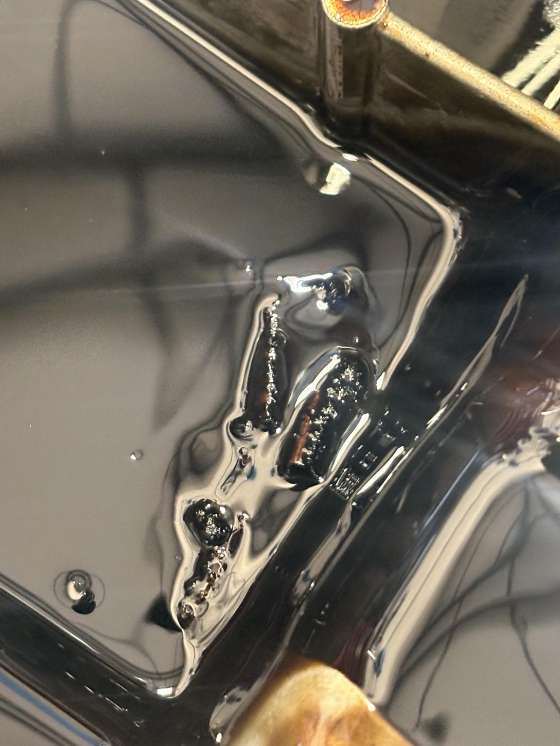 Wet belt fragments in drained engine oil